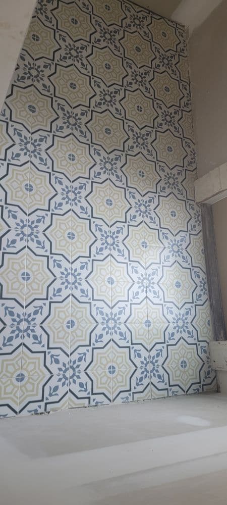 Colorful geometric tile wall pattern in a modern interior setting. Elegant design details.