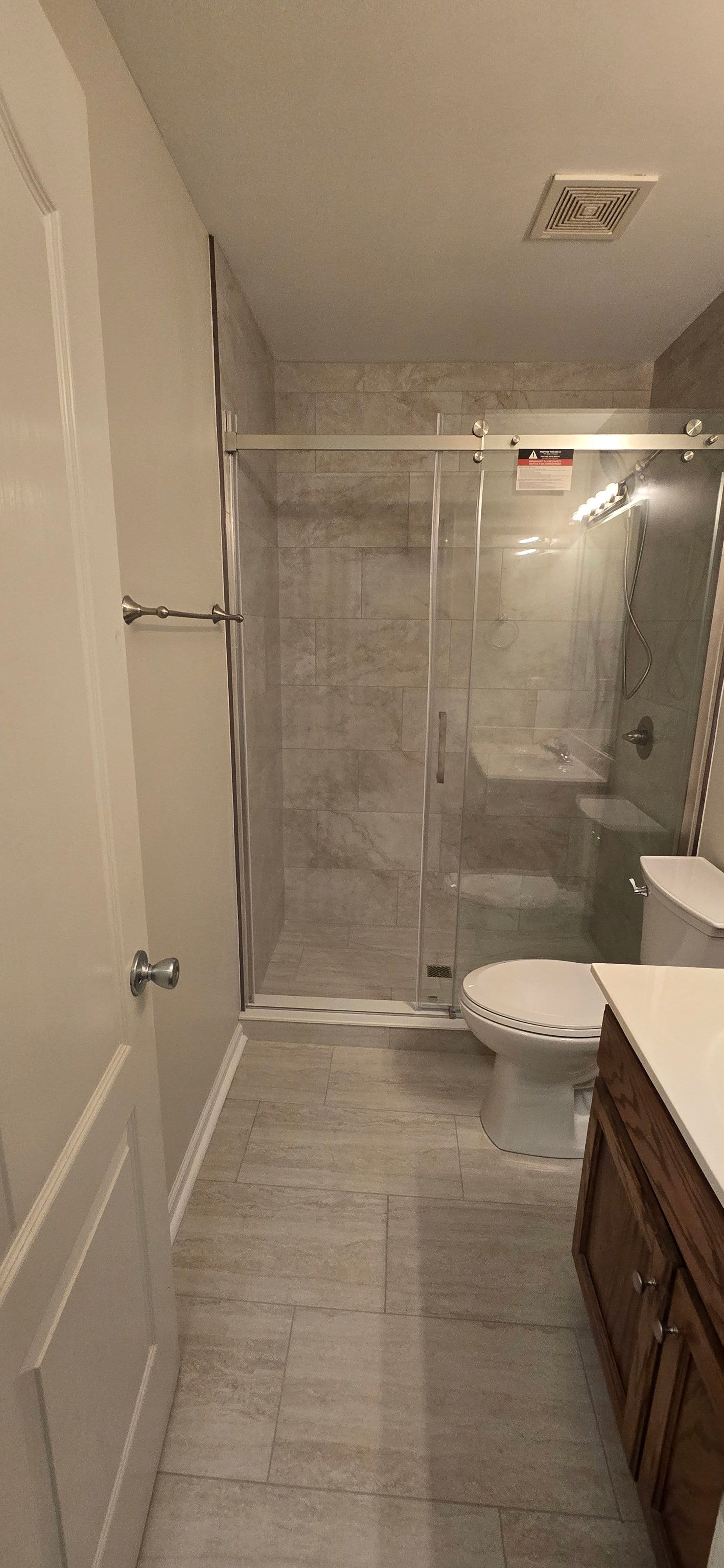 Bathroom Renovation with Porcelain Tile and Euro Glide Doors image
